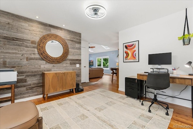 3765 E Easter Dr, Centennial, CO 80122 - home office featuring wood walls, wood finished floors, and an accent wall