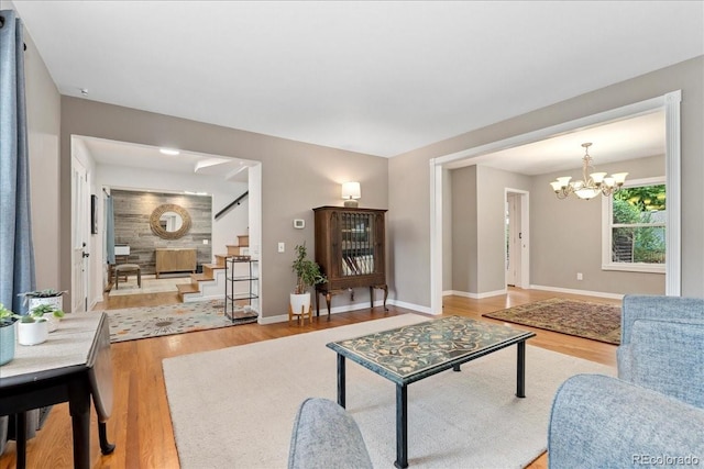 3765 E Easter Dr, Centennial, CO 80122 - living room with wood finished floors, stairs, and a chandelier
