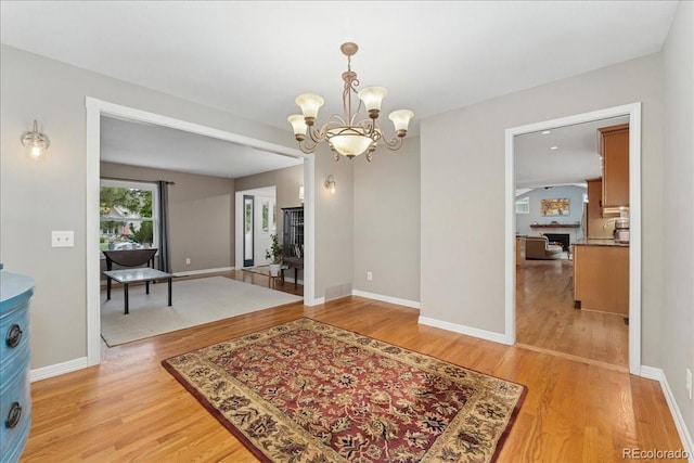 3765 E Easter Dr, Centennial, CO 80122 - dining area with light wood finished floors and a chandelier