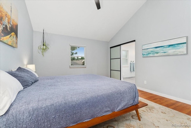 3765 E Easter Dr, Centennial, CO 80122 - bedroom featuring wood finished floors, ceiling fan, ensuite bathroom, and high vaulted ceiling
