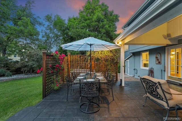 3765 E Easter Dr, Centennial, CO 80122 - patio terrace at dusk with a yard, a patio, and outdoor dining area