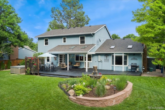 3765 E Easter Dr, Centennial, CO 80122 - rear view of property with a hot tub, a patio, and a shingled roof