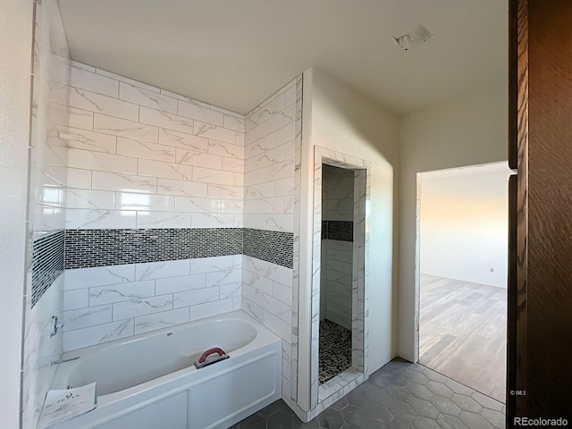 bathroom featuring tile patterned floors and plus walk in shower