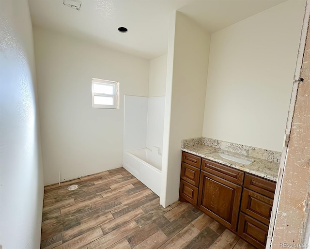 bathroom with a bathtub and vanity