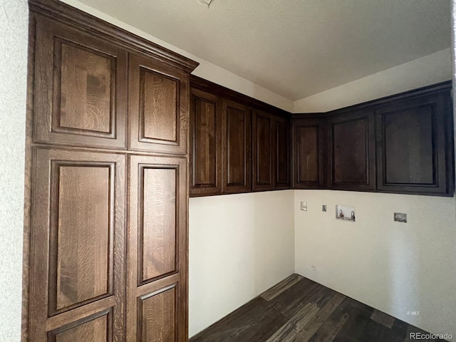 laundry area with cabinets, washer hookup, dark hardwood / wood-style flooring, and electric dryer hookup