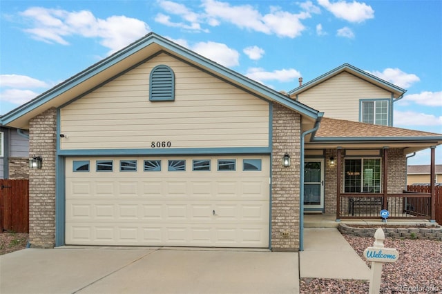 8060 Willowick Ct, Colorado Springs, CO 80925 - single story home featuring covered porch, concrete driveway, a garage, and brick siding