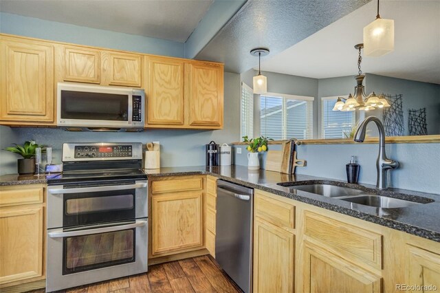 8060 Willowick Ct, Colorado Springs, CO 80925 - kitchen with appliances with stainless steel finishes, a sink, and light brown cabinetry