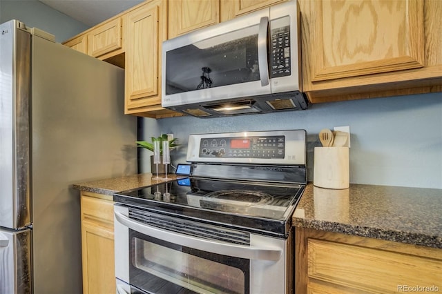 8060 Willowick Ct, Colorado Springs, CO 80925 - kitchen with stainless steel appliances, light brown cabinetry, and dark countertops