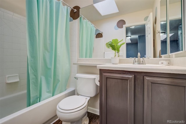8060 Willowick Ct, Colorado Springs, CO 80925 - full bath featuring shower / bathtub combination with curtain, toilet, vanity, and a skylight