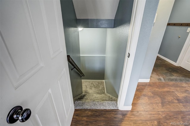 8060 Willowick Ct, Colorado Springs, CO 80925 - staircase featuring baseboards and wood finished floors
