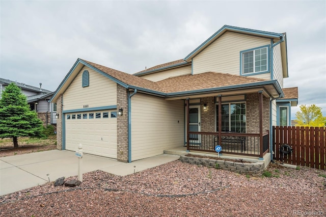 8060 Willowick Ct, Colorado Springs, CO 80925 - traditional-style house featuring a porch, brick siding, a garage, concrete driveway, and roof with shingles