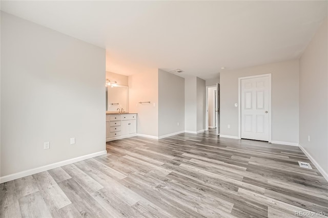 unfurnished room with light hardwood / wood-style flooring