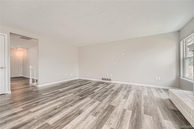 spare room with light hardwood / wood-style flooring