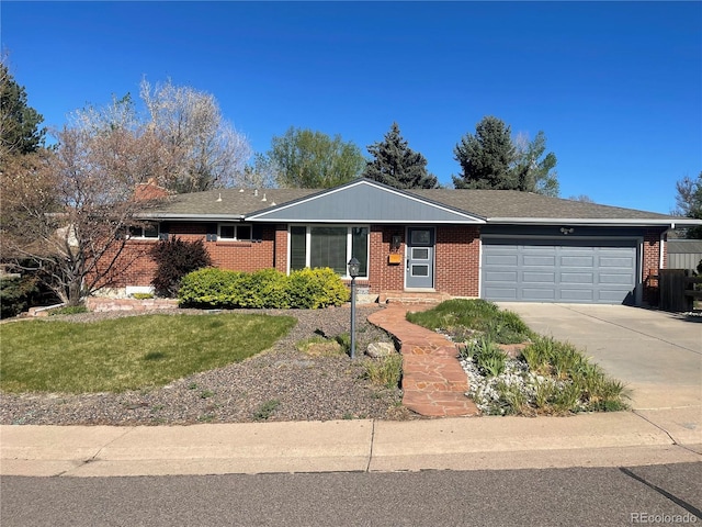 single story home featuring brick siding, driveway, and a garage
