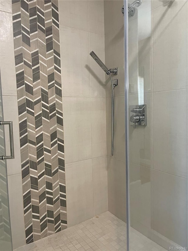 bathroom with a shower stall