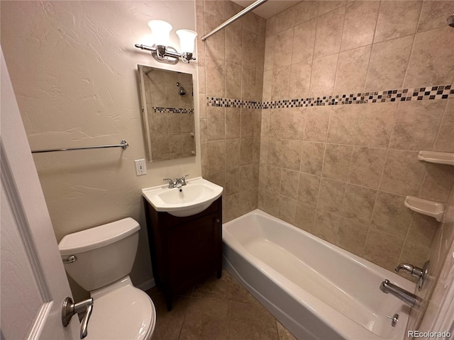 bathroom featuring toilet, tile patterned flooring, bathing tub / shower combination, and vanity