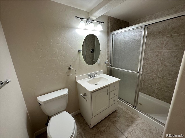 full bathroom with toilet, vanity, tile patterned floors, a stall shower, and a textured wall