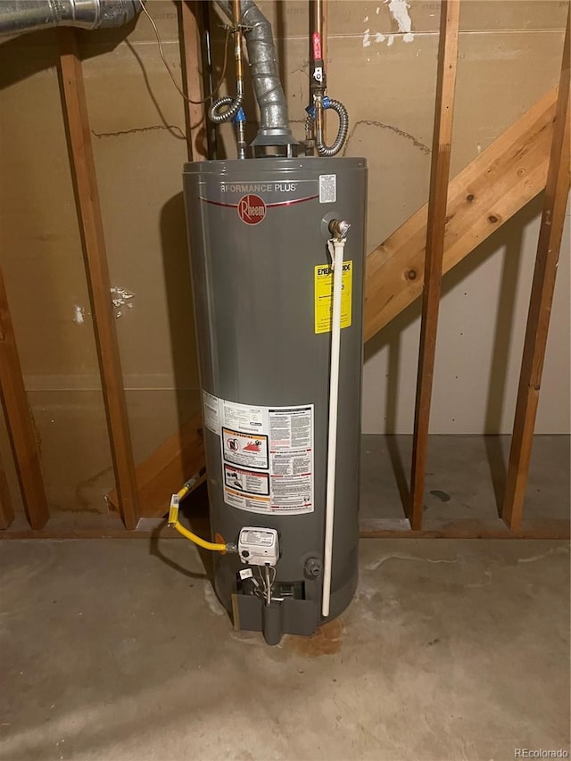 utility room featuring gas water heater