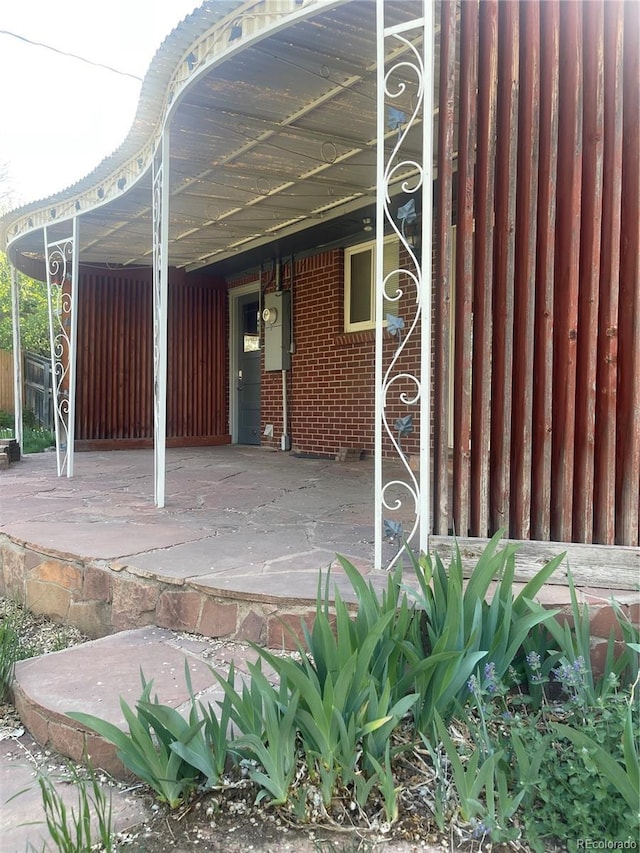 exterior space with brick siding