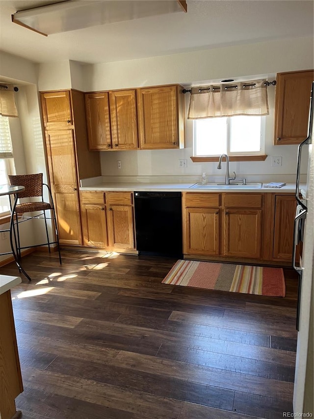9724 W Euclid Dr, Littleton, CO 80123 - kitchen featuring black dishwasher, a sink, dark wood-style floors, and brown cabinets
