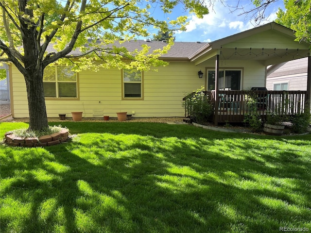 9724 W Euclid Dr, Littleton, CO 80123 - back of house featuring a lawn and a deck