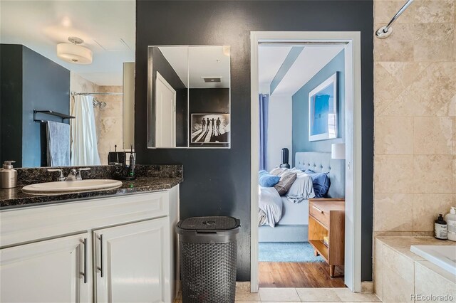 bathroom featuring tile patterned flooring and vanity