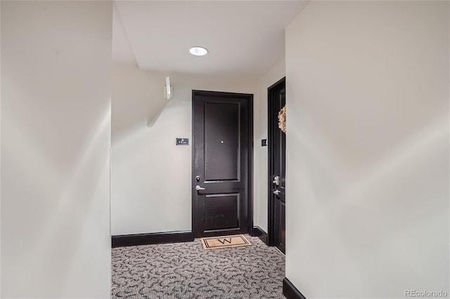 hallway featuring carpet flooring