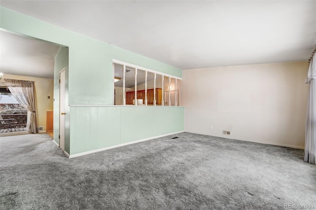 unfurnished room with carpet and visible vents