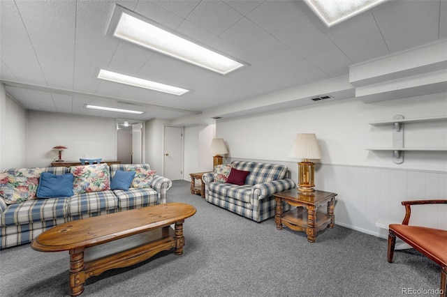 living area with carpet and visible vents