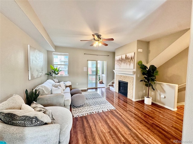 living room with ceiling fan and hardwood / wood-style floors