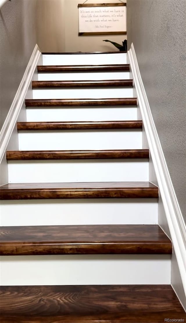 stairway with wood-type flooring