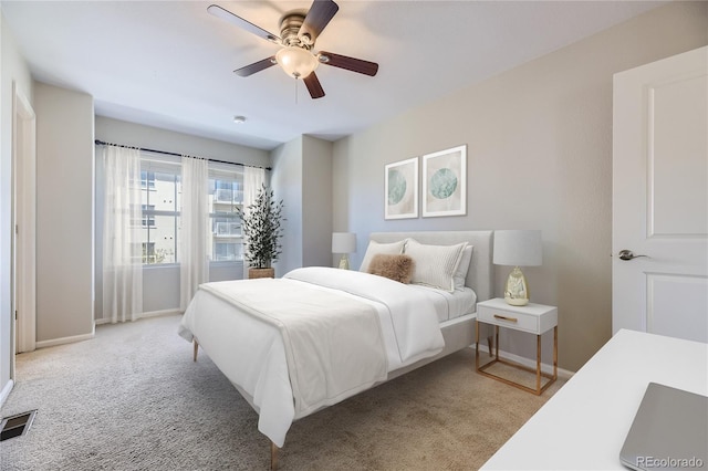 bedroom featuring ceiling fan and light colored carpet