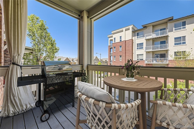 wooden deck with grilling area