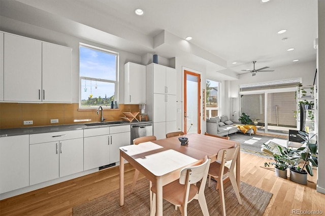 2004 Foxtail Ln Unit B, Lafayette, CO 80026 - kitchen with a sink, stainless steel dishwasher, light wood-style floors, recessed lighting, and tasteful backsplash