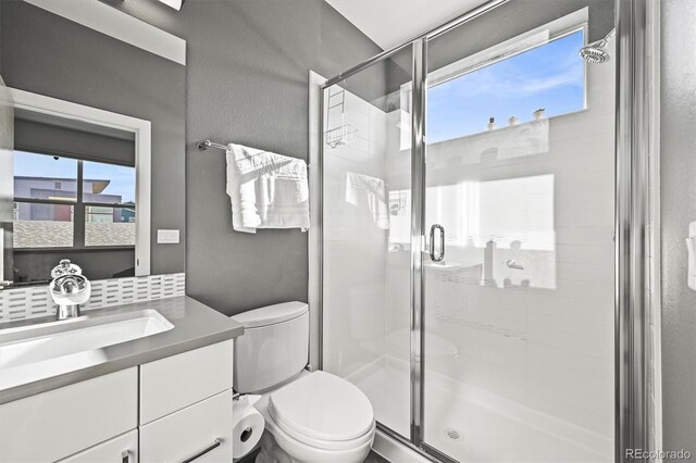 2004 Foxtail Ln Unit B, Lafayette, CO 80026 - full bathroom featuring toilet, vanity, and a shower stall