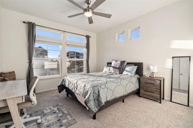 carpeted bedroom with baseboards and ceiling fan