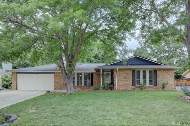 7427 S Ames Ct, Littleton, CO 80128 - ranch-style house featuring brick siding, driveway, and an attached garage