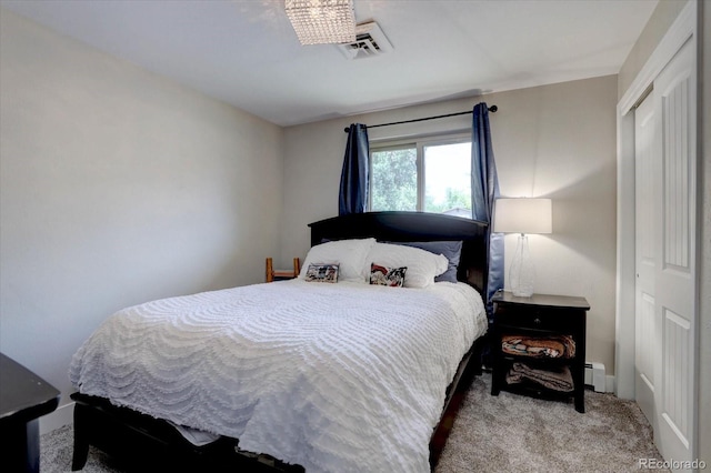7427 S Ames Ct, Littleton, CO 80128 - carpeted bedroom featuring a closet and a baseboard radiator