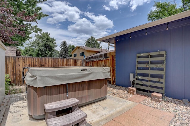 7427 S Ames Ct, Littleton, CO 80128 - view of patio / terrace with a hot tub