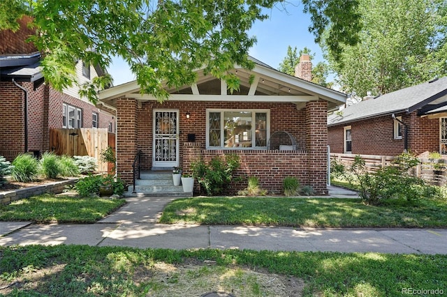 3437 W 35th Ave, Denver, CO 80211 - view of front of property with a chimney and brick siding