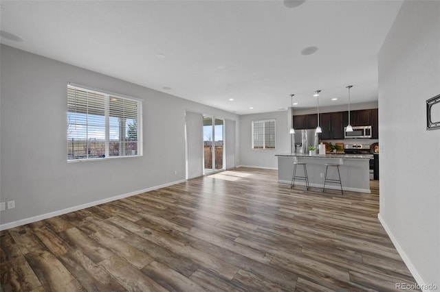 unfurnished living room featuring dark hardwood / wood-style flooring