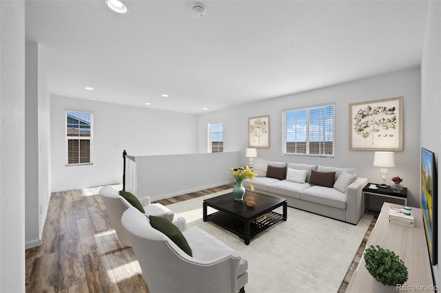 living room with light hardwood / wood-style flooring