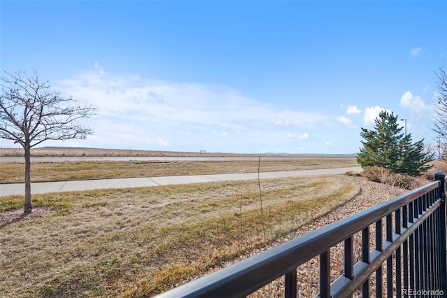 view of yard with a rural view