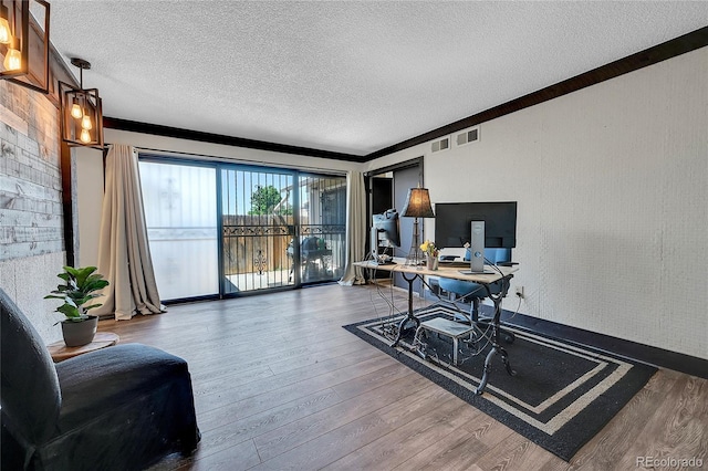 office area with hardwood / wood-style flooring and a textured ceiling