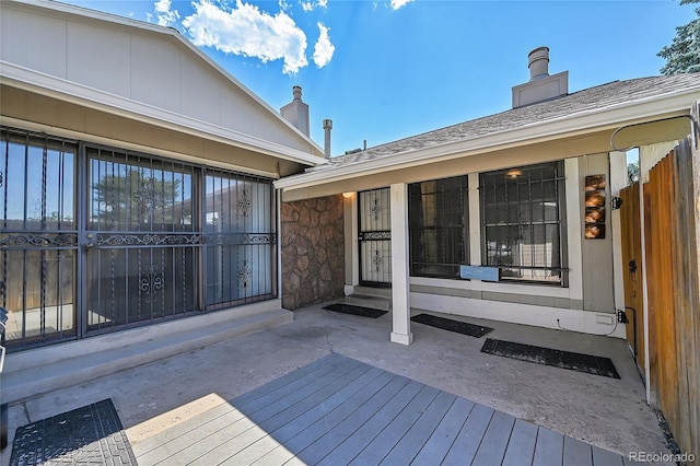 wooden deck with a patio