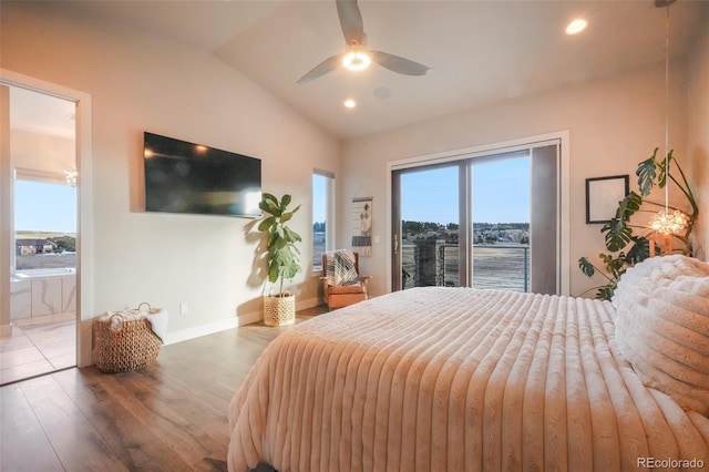 bedroom featuring access to exterior, vaulted ceiling, multiple windows, and wood finished floors