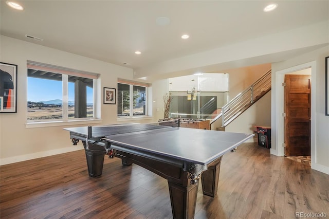 recreation room with recessed lighting, wood finished floors, and baseboards