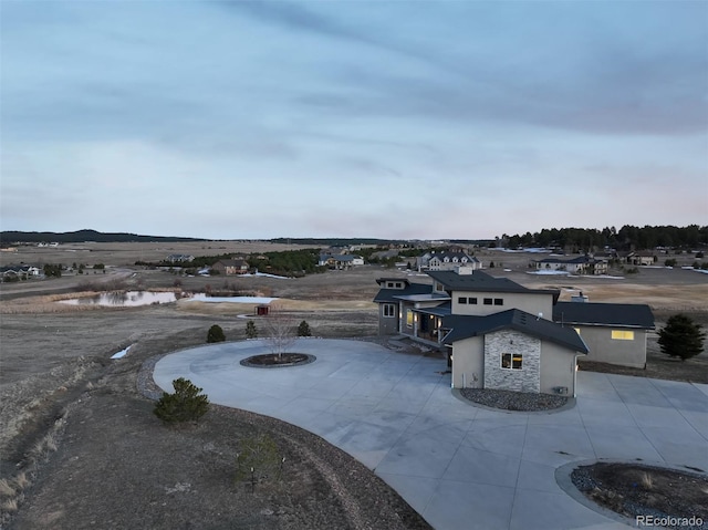 view of patio / terrace featuring curved driveway