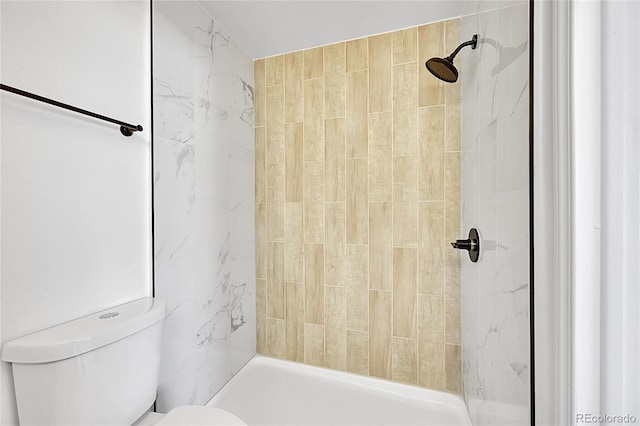 full bath featuring toilet and tiled shower