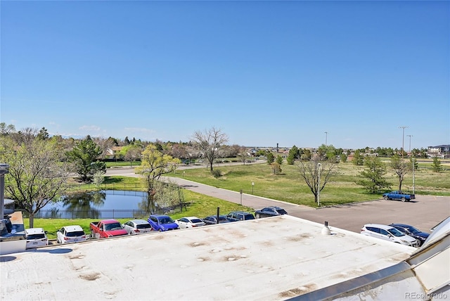 birds eye view of property with a water view